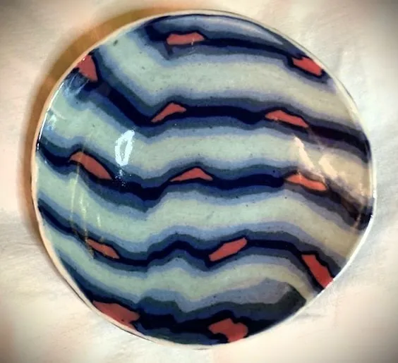 Small hand built bowl colored clay